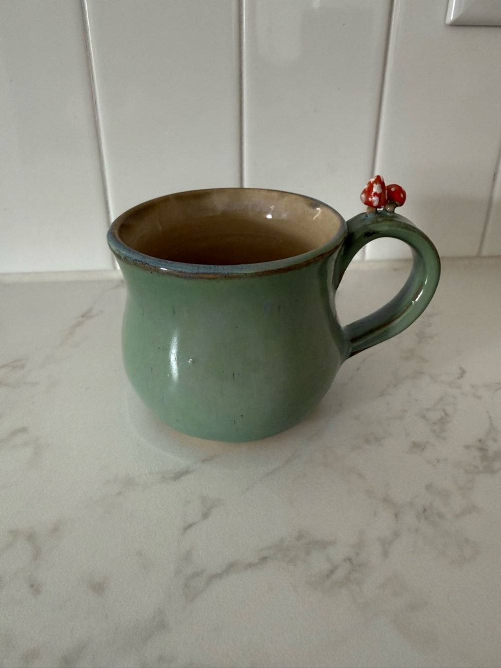 Green Tea Mug with Red Mushroom Accent